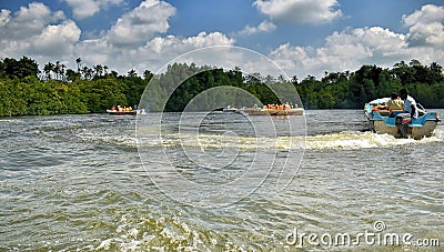 Boats at Madu River Editorial Stock Photo