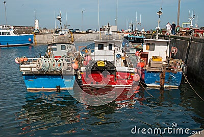 Boats moored in an English harbour on a sunny day Stock Photo