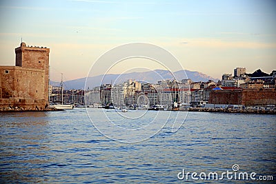 Boats moored in the harbor with tower, Parc National des Calanques, Marseille, France Stock Photo