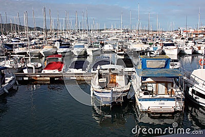 Boats moored at the Ibiza tourist pier in the summer Editorial Stock Photo