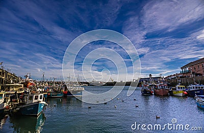 Boats moored in Scarborough Harbour on a sunny autumn day. Editorial Stock Photo