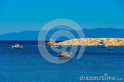 Boats mooring alongside Koroni castle in Greece Stock Photo