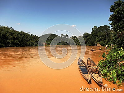 Boats on muddy river Stock Photo