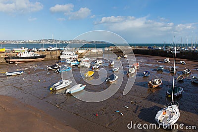 Boats in Paignton harbour Devon England with view to Torquay Stock Photo