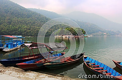 Boats at the Phewa lake in Pokhara, Nepal Stock Photo