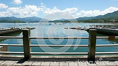 Boats, pier, lake and the white cloud in sunny day Editorial Stock Photo