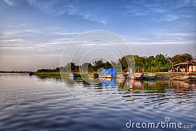 Boats resting on the bank of a river Stock Photo