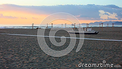 Boats resting on the beach in their parking area waiting for the summer Editorial Stock Photo