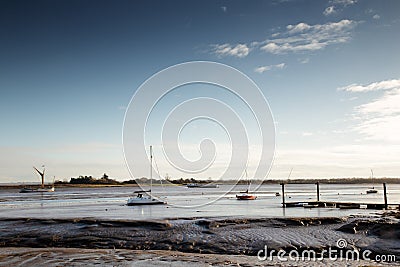 Boats sitting on mud Stock Photo