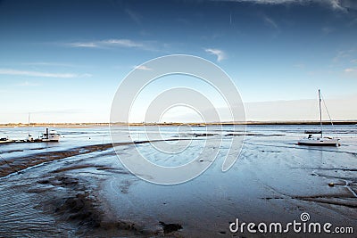 Boats sitting on mud Stock Photo