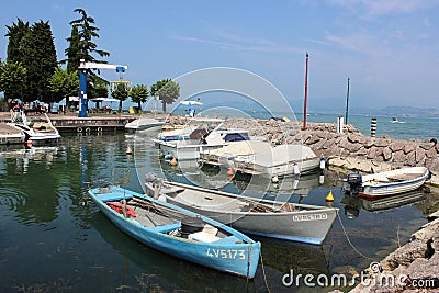 Boats in a small harbor at Peschiera, Lake Garda Editorial Stock Photo