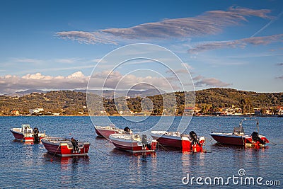 Boats standing near shore at sunset Stock Photo