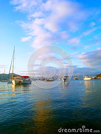 Boats standing where the sea mets the sky Stock Photo