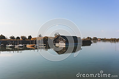 Boats stands near boathouse in a lake Stock Photo