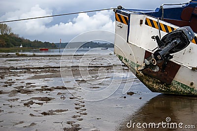 Boats stranded by low tide on the River Orwell at Pin Mill, Suffolk Editorial Stock Photo