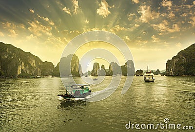 Boats, Sunset at Ha Long Bay Stock Photo