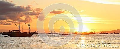 Boats on sunset sea Stock Photo