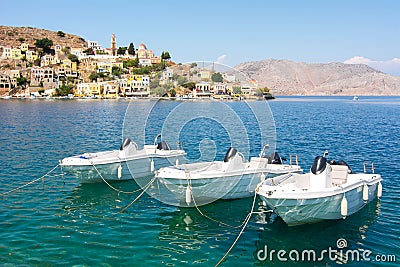 Boats in Symi town harbor, Dodecanese islands, Greece Stock Photo