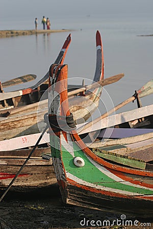 Boats tied up on shore Stock Photo