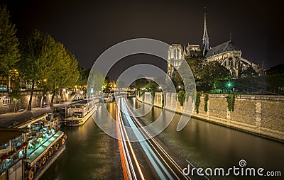 Boats traffic in the seine next to Notre-Dame Stock Photo