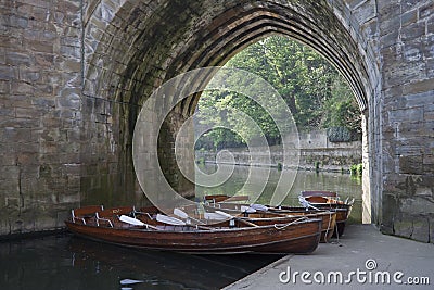 Boats under archway on River Wear, Durham City. Editorial Stock Photo