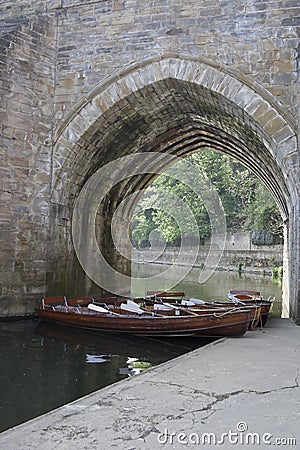 Boats under archway on River Wear, Durham City. Editorial Stock Photo