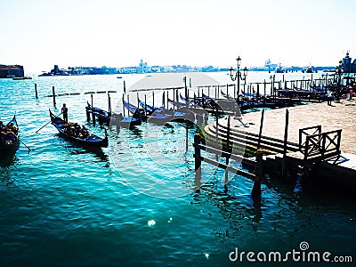 Boats of Venice and brilliant blue waters Stock Photo