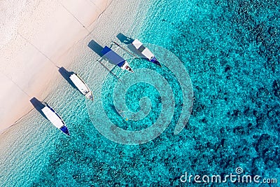 Boats on the water surface from top view. Azure water background from top view. Summer seascape from air. Stock Photo