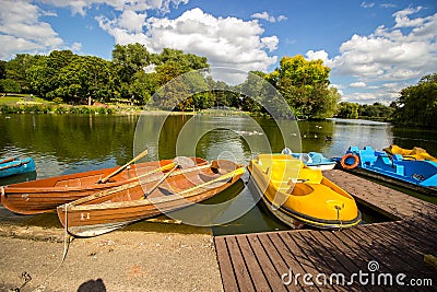 Boats at wooden dock, Birmingham, England Stock Photo