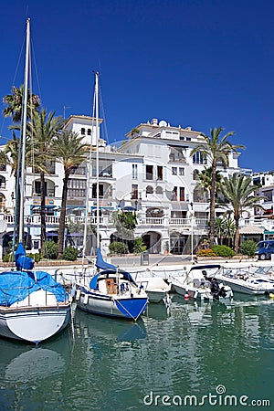 Boats and yachts moored in Duquesa port in Spain on the Costa de Stock Photo