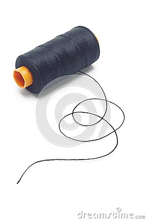 Bobbin of black cotton thread Stock Photo