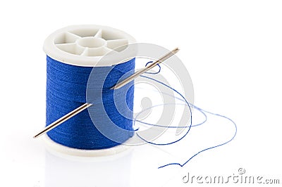 Bobbin with blue thread Stock Photo