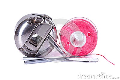 Bobbin case, plastic bobbin and sewing needles Stock Photo