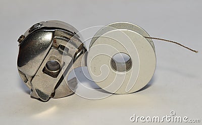 Bobbin case and stainless bobbin Stock Photo