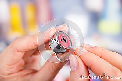 Bobbin case threading Stock Photo