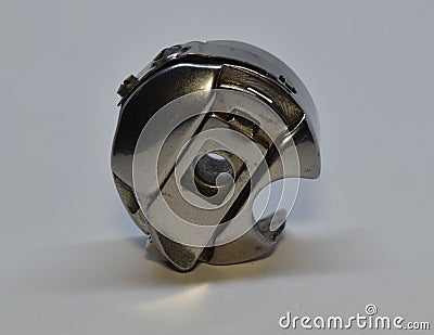 A bobbin case on white background. Stock Photo