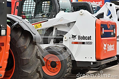 Bobcat heavy duty equipment vehicle and logo Editorial Stock Photo