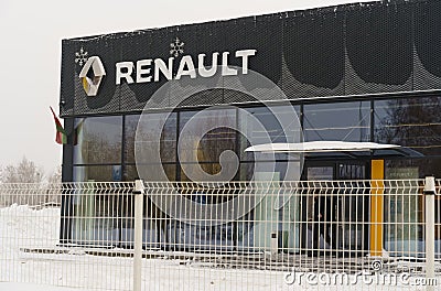 Renault brand logo on the car dealership wall, in winter. Editorial Stock Photo