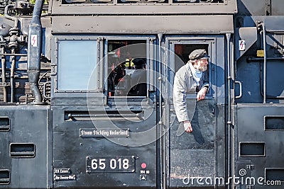 Bochum , Germany - April 18 2015 : Worker observing the activities at the railway main station Editorial Stock Photo