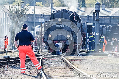 Bochum , Germany - April 18 2015 : Worker observing the activities at the railway main station Editorial Stock Photo