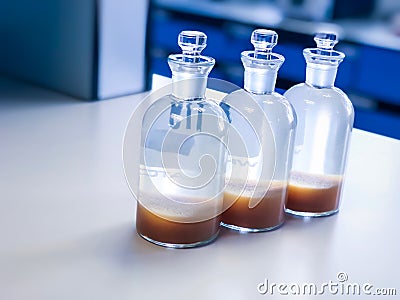 BOD bottle for analysis Dissolve Oxygen in waste water sample, precipitation with solvent in flask. Stock Photo