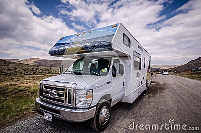 Cruise America RV recreational vehicle is parked in Bodie Ghost Town. These cars are rental Editorial Stock Photo