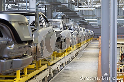 Body of car on conveyor Modern Assembly of cars at plant. automated build process of car body Stock Photo