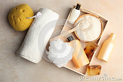 Body care cosmetics, sea salt, natural soap on wooden tray Stock Photo