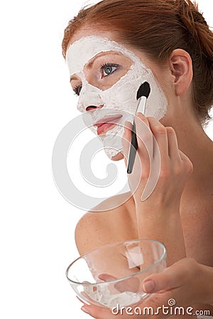 Body care - Young woman apply facial mask Stock Photo