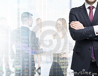 A body in a formal suit with crossed hands. A figures of the professionals in formal clothes on the background. Stock Photo