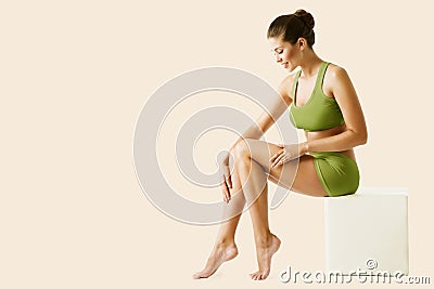 Body Leg Beauty Woman. Natural Skin Care Green Treatment. Slim Model applying depilation Cream. Body Spa Massage Stock Photo