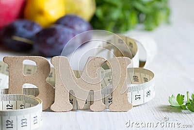 Body mass index BMI with measuring tape and fruits concept Stock Photo