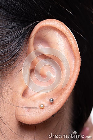 Body Part of Asian female Ear left side Stock Photo