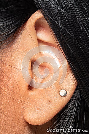 Body Part of Asian female Ear left side Stock Photo